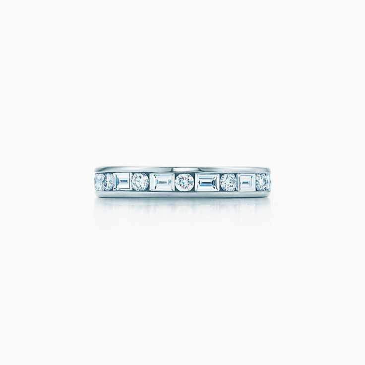 Channel-set band ring with diamonds in platinum, 3mm wide.