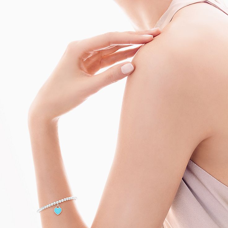 Return to Tiffany's mini heart tag in sterling silver on a bead bracelet.