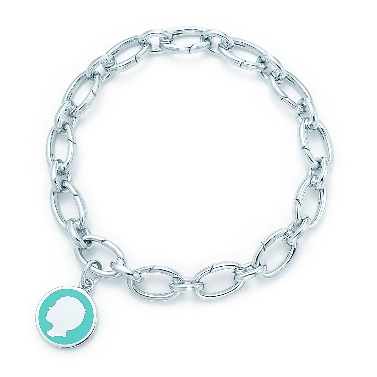 Boy tag charm in silver with blue enamel finish on a clasping link bracelet. | Tiffany & Co.