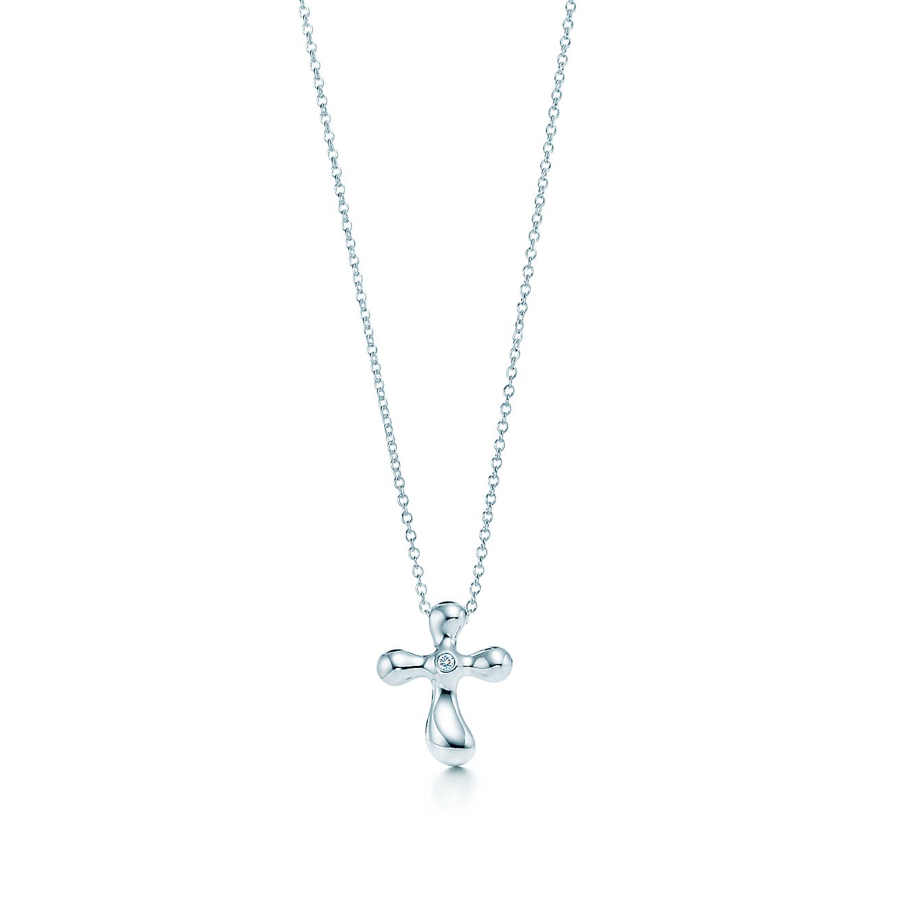 Elsa Peretti® Cross pendant. Diamonds, silver. Tiffany & Co.