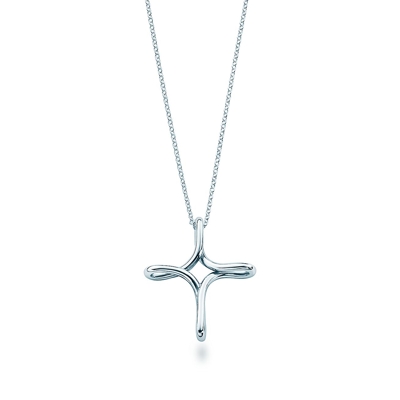 Elsa Peretti® Infinity Cross pendant in sterling silver, 26 mm wide. Tiffany & Co.