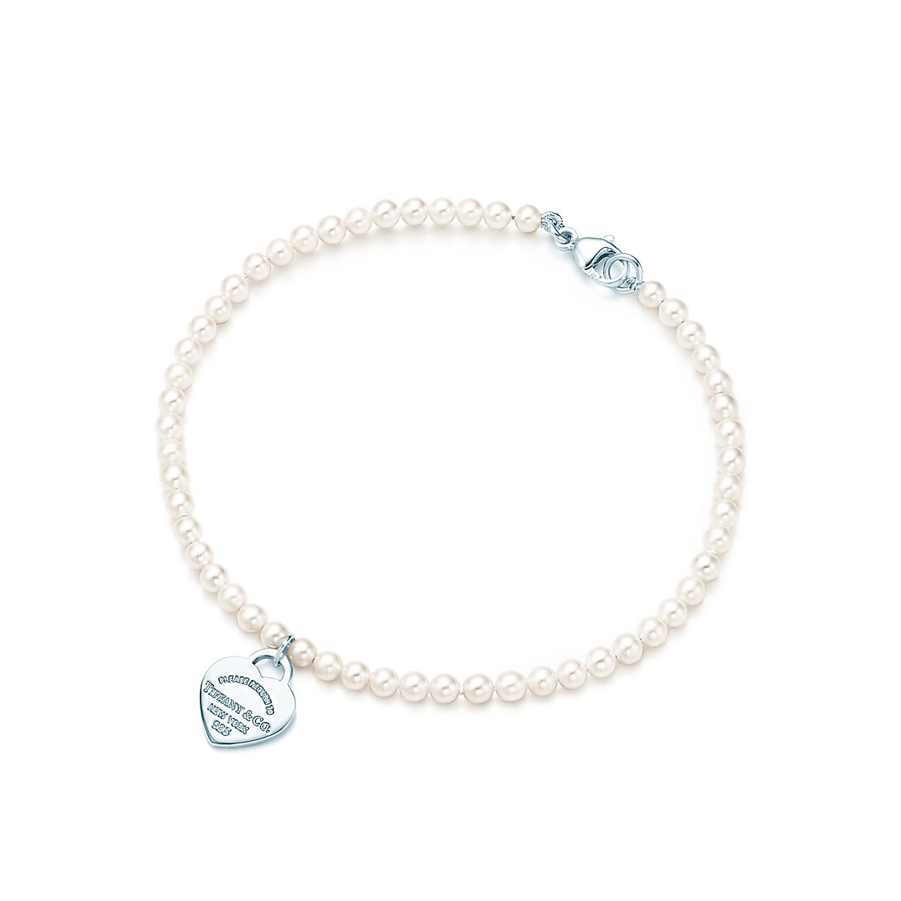 Return to Tiffany™ mini heart tag in silver on a freshwater pearl