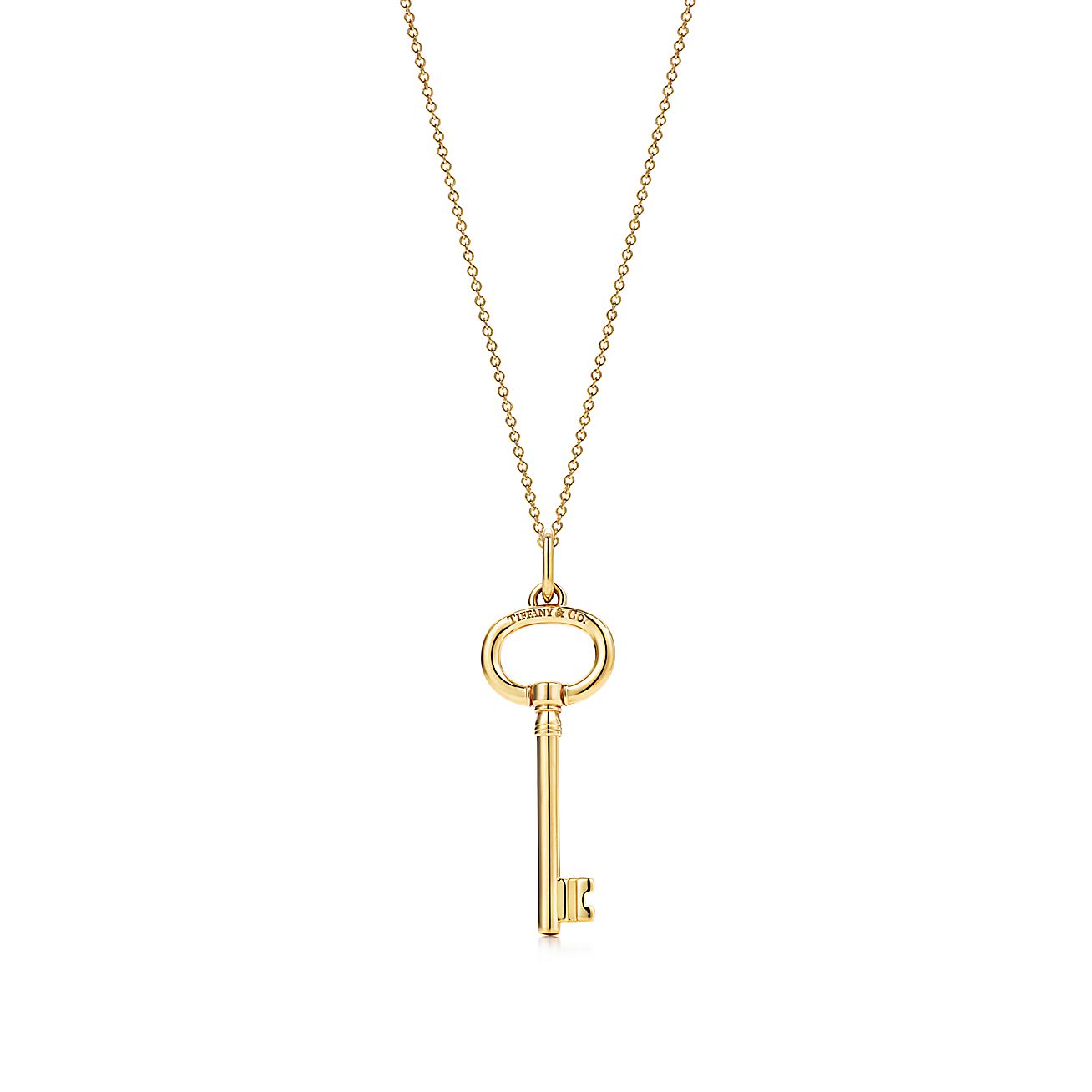 Tiffany Keys oval key pendant in 18k gold on a chain. Tiffany & Co.