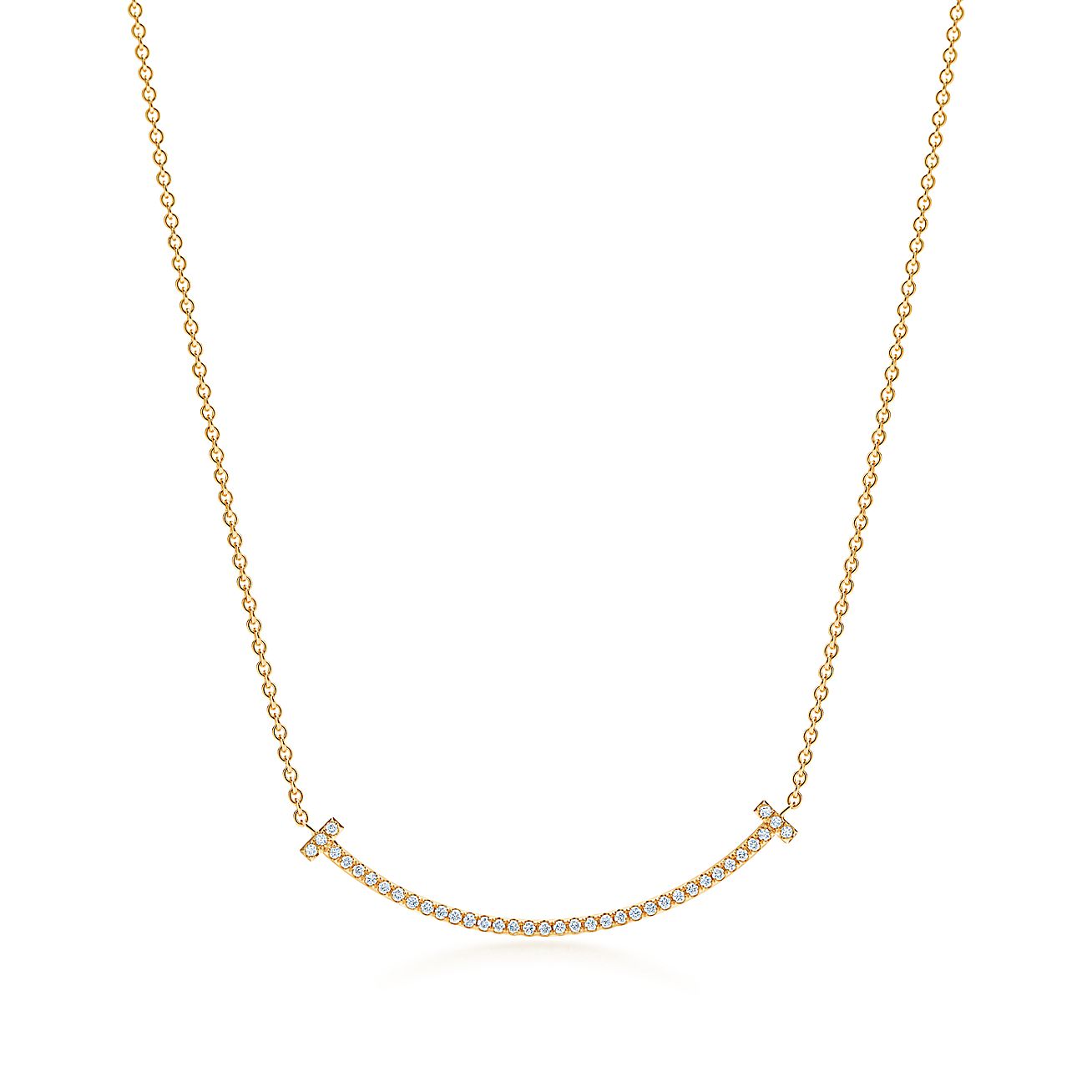 Tiffany T smile pendant in 18k gold with diamonds, mini. Tiffany & Co.