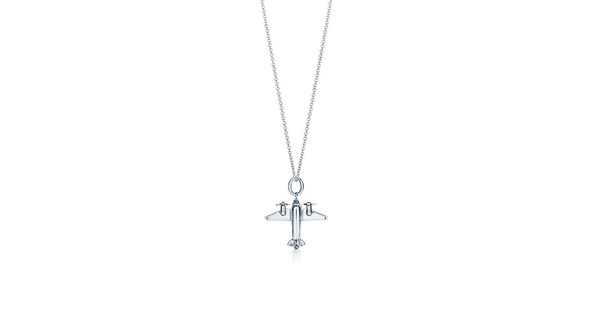 Airplane charm in sterling silver on a chain. Tiffany & Co.