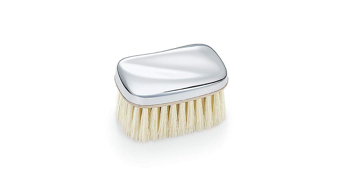 Elsa Peretti® Wave baby brush in sterling silver. Tiffany & Co.