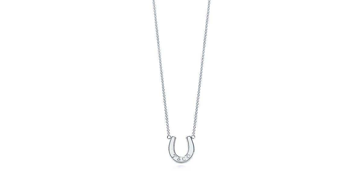 T&CO.® horseshoe pendant in sterling silver. Tiffany & Co.