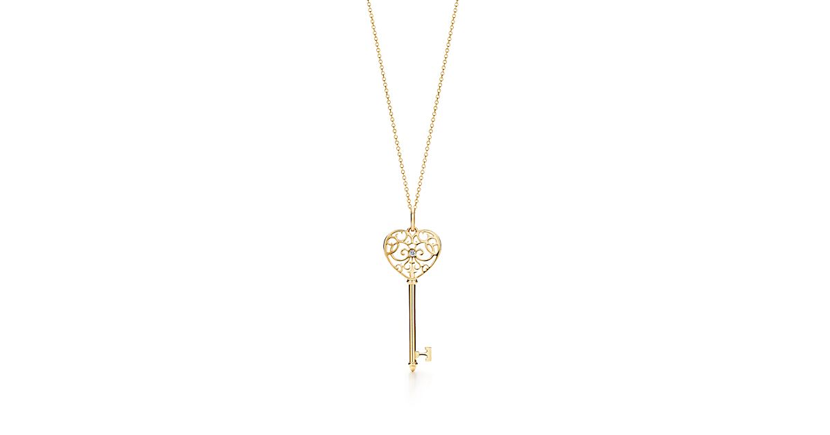 Tiffany Enchant® heart key pendant in 18k gold with diamonds. Tiffany