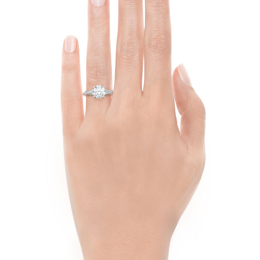 Round cut diamond ring with tapered baguettes