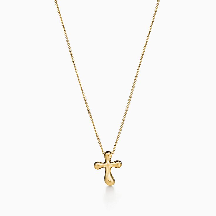 Elsa Peretti® cross pendant in 18k gold, 14 mm wide. | Tiffany
