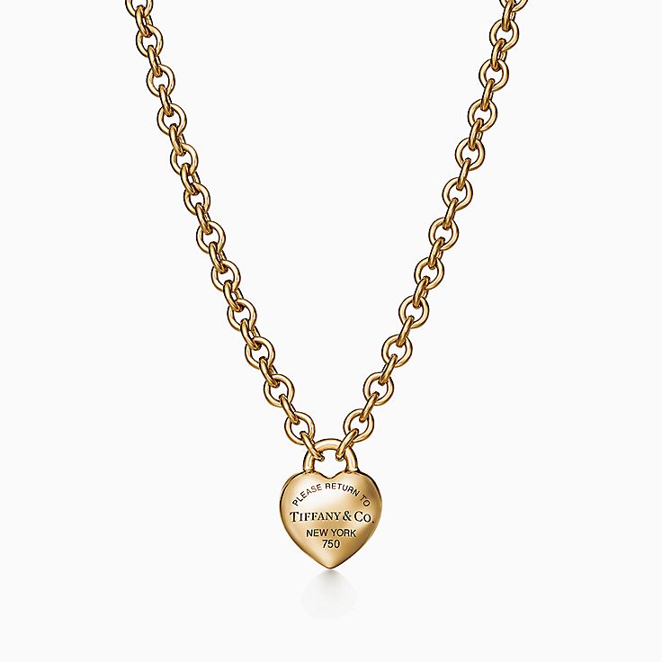 Tiffany Keys modern keys open round key pendant in 18k gold with diamonds,  mini.