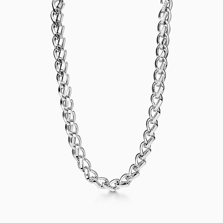Tiffany T pendant in 18k white gold with a baguette diamond. | Tiffany & Co.