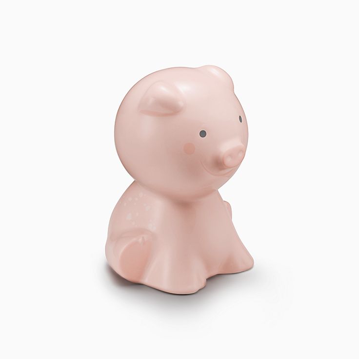 Dot piggy bank in earthenware with pink accents.