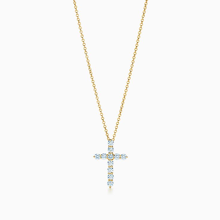 Cross pendant in 18k gold with diamonds, small.