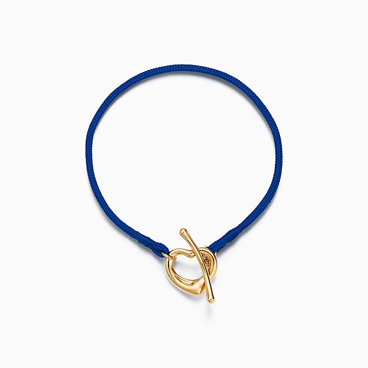 Elsa Peretti™ Open Heart Bracelet in Yellow Gold on a Cobalt Silk