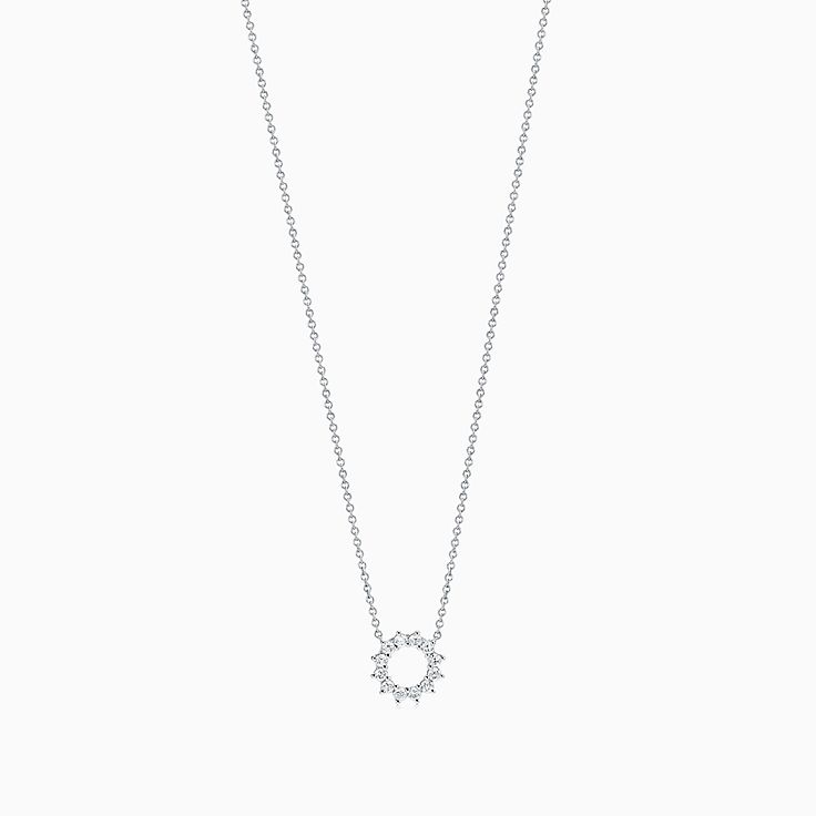 Open circle pendant in platinum with 