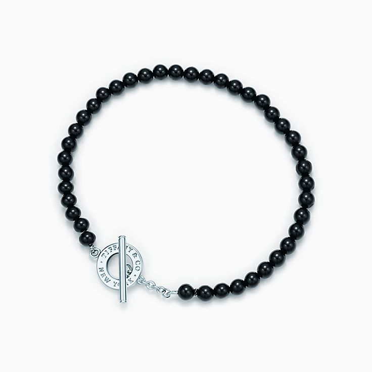 The Healing bracelet with matt black onyx beads and silver motif -