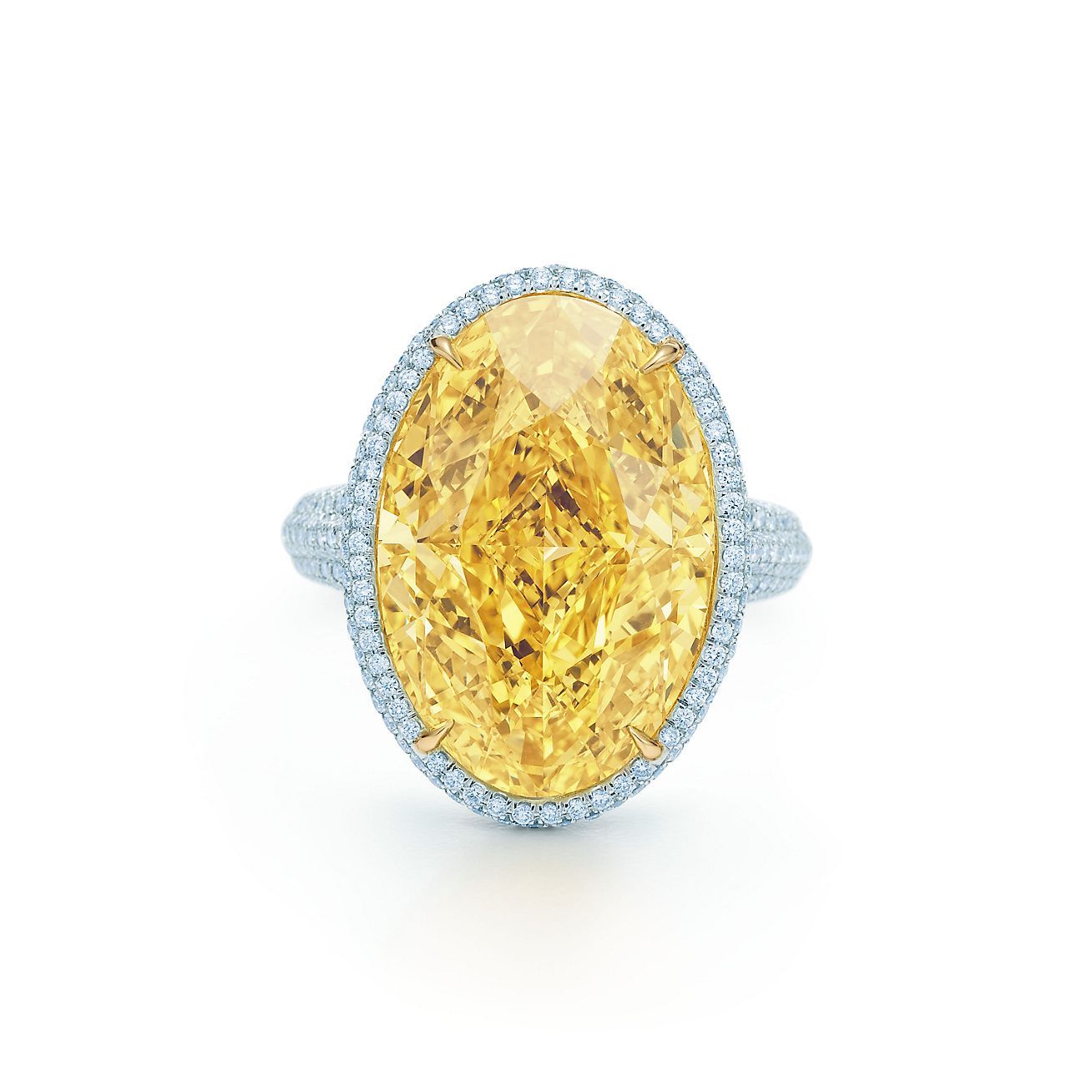 Anillo de platino y oro de 18k con un diamante amarillo de 15.04