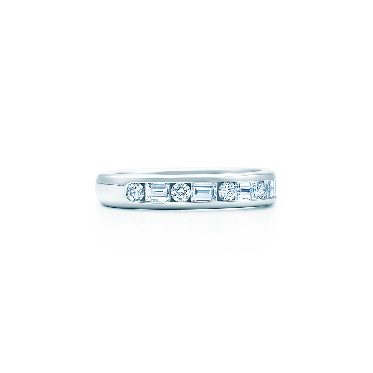 Channel-set band ring with diamonds in platinum, 3mm wide.