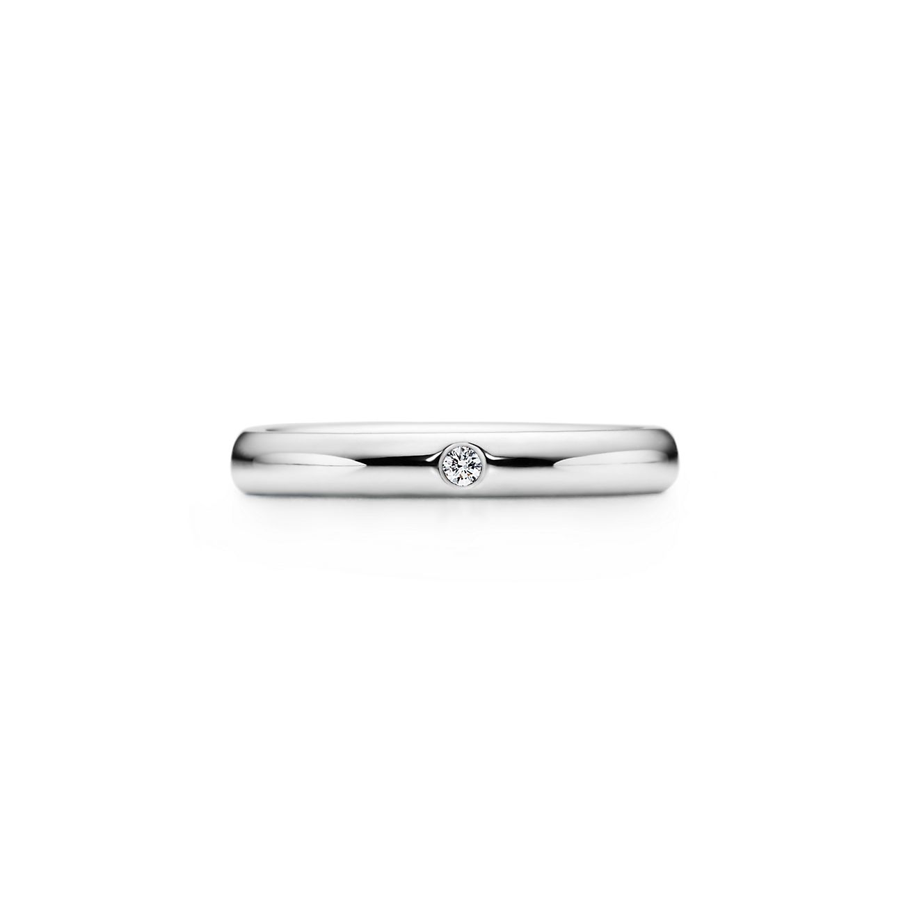 Elsa Peretti® band ring with a diamond in platinum. | Tiffany & Co.