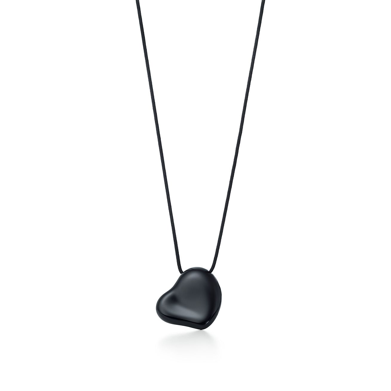 Elsa Peretti® Full Heart black pendant in ruthenium on a silk cord, 26 mm wide.