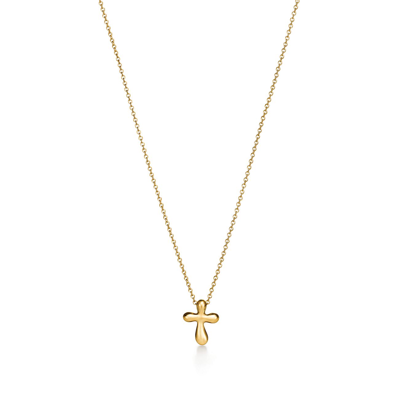 Elsa Peretti® cross pendant in 18k gold, 12 mm wide. | Tiffany
