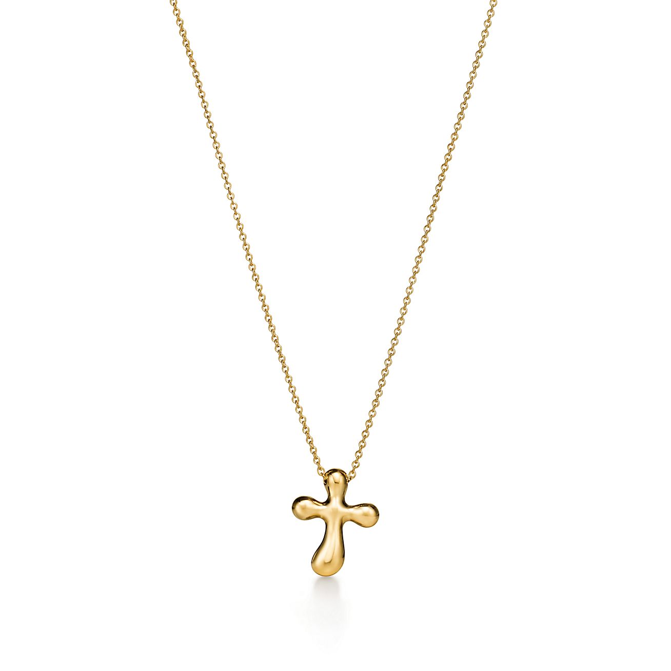 Elsa Peretti® cross pendant in 18k gold, 14 mm wide. | Tiffany