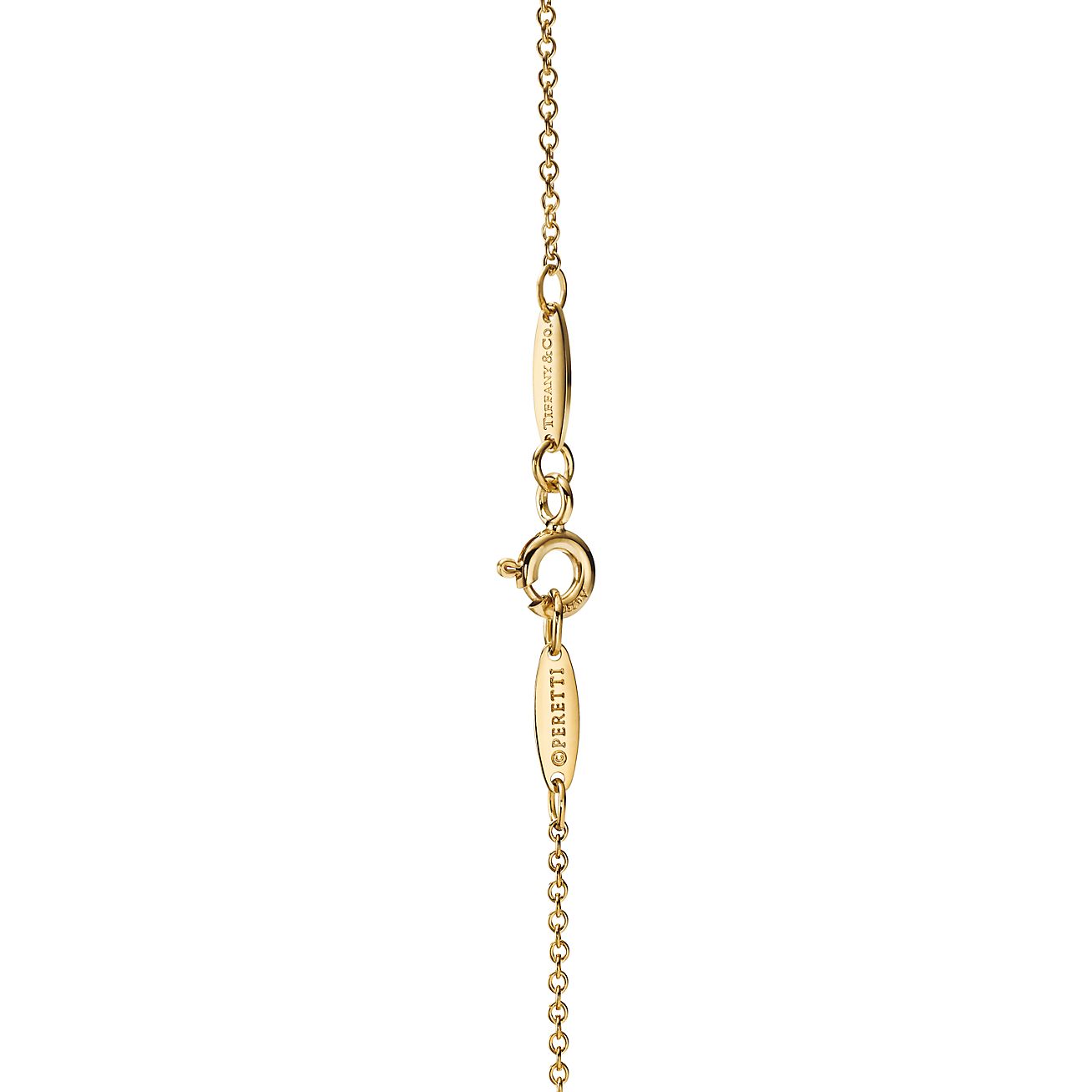 Elsa Peretti® cross pendant in 18k gold, 14 mm wide. | Tiffany