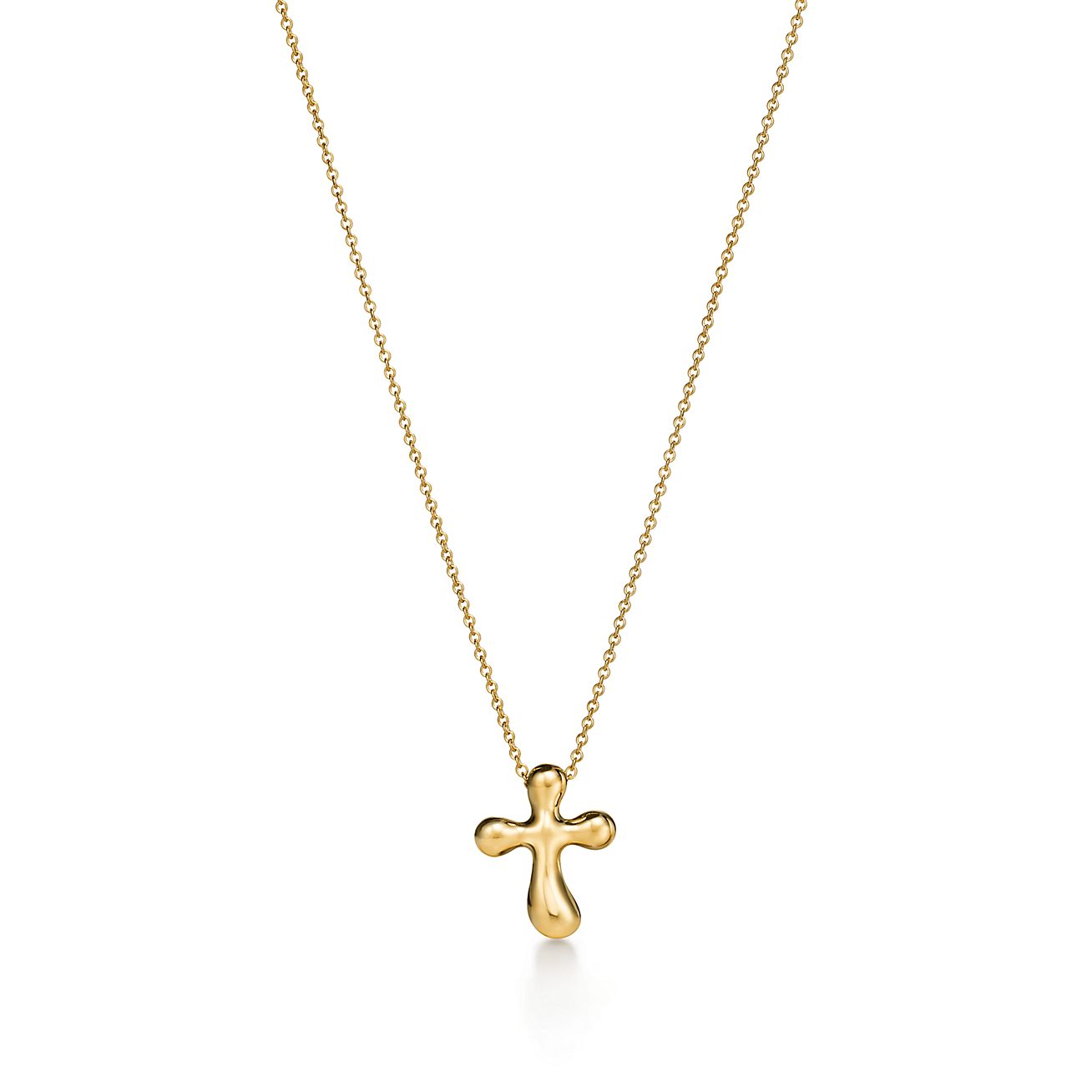 Elsa Peretti® cross pendant in 18k gold, 14 mm wide. | Tiffany