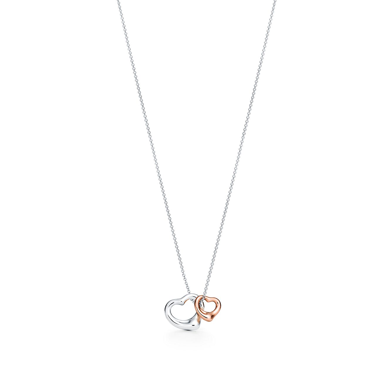 Elsa Peretti® Open Heart pendant in silver and 18k rose gold, extra mini.