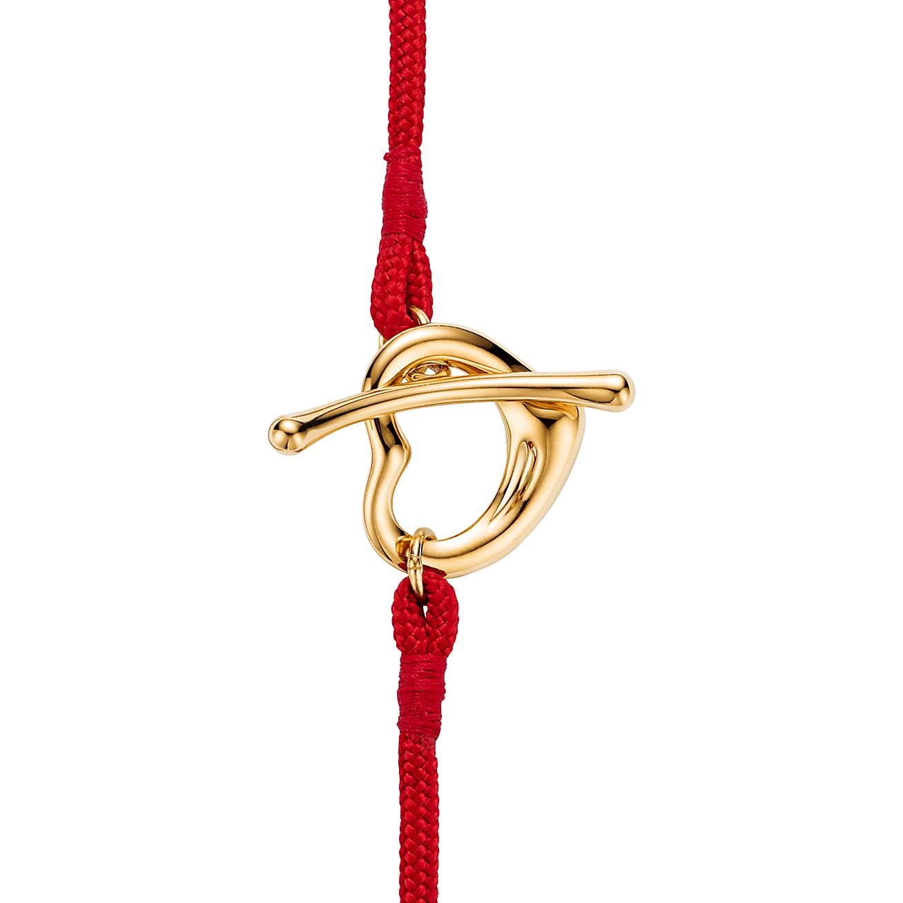 Elsa Peretti® Open Heart Bracelet in Yellow Gold on a Red