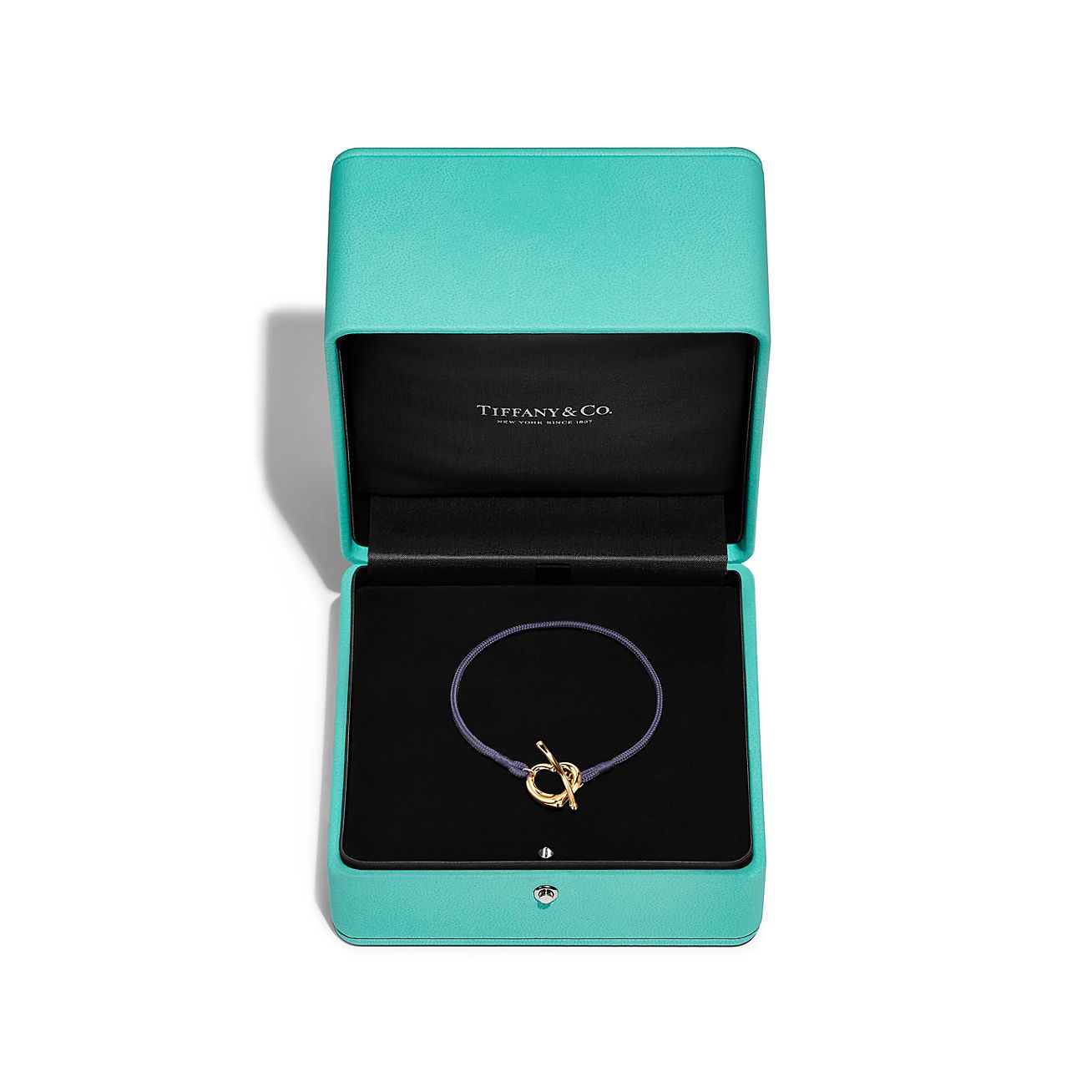 Elsa Peretti® Open Heart Bracelet in Yellow Gold on a Purple Silk Cord - Alternate shot 1 - Alternate shot 2 - Alternate shot 3
