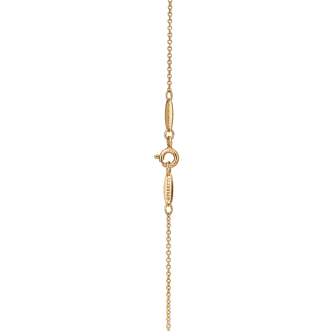 Elsa Peretti™ Open Heart pendant in 18k gold with diamonds
