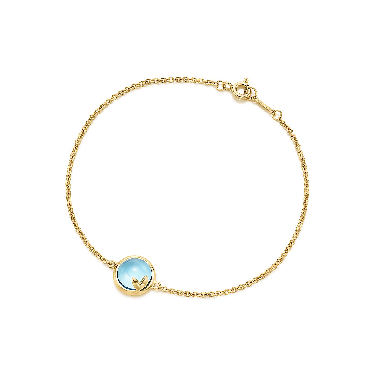 Paloma Picasso® Olive Leaf bracelet in 18k gold with a blue topaz ...