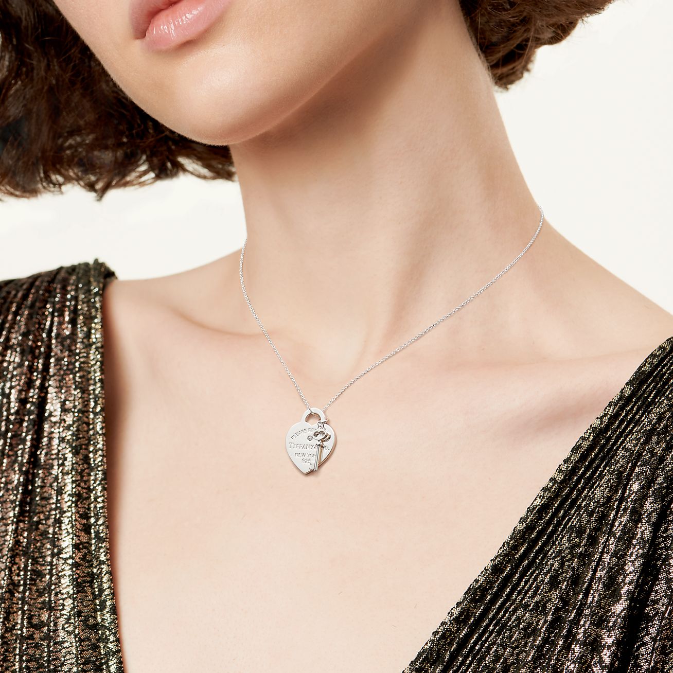 Return to Tiffany® medium heart tag with key pendant in sterling silver.
