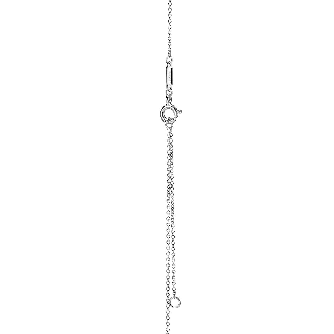 Return to Tiffany™ small heart tag in sterling silver on a bead necklace.