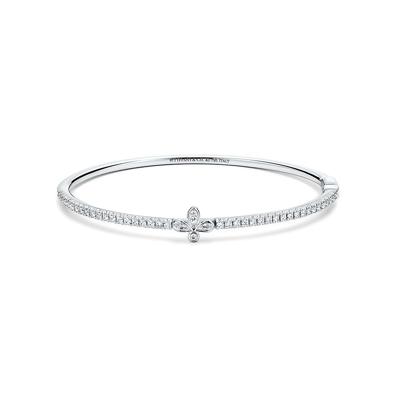 Tiffany Fleur De Lis Bangle In 18 White Gold With Diamonds Medium Tiffany Co French for lily flower, the regal fleur de lis motif adds a refined sensibility to this collection. tiffany fleur de lis bangle