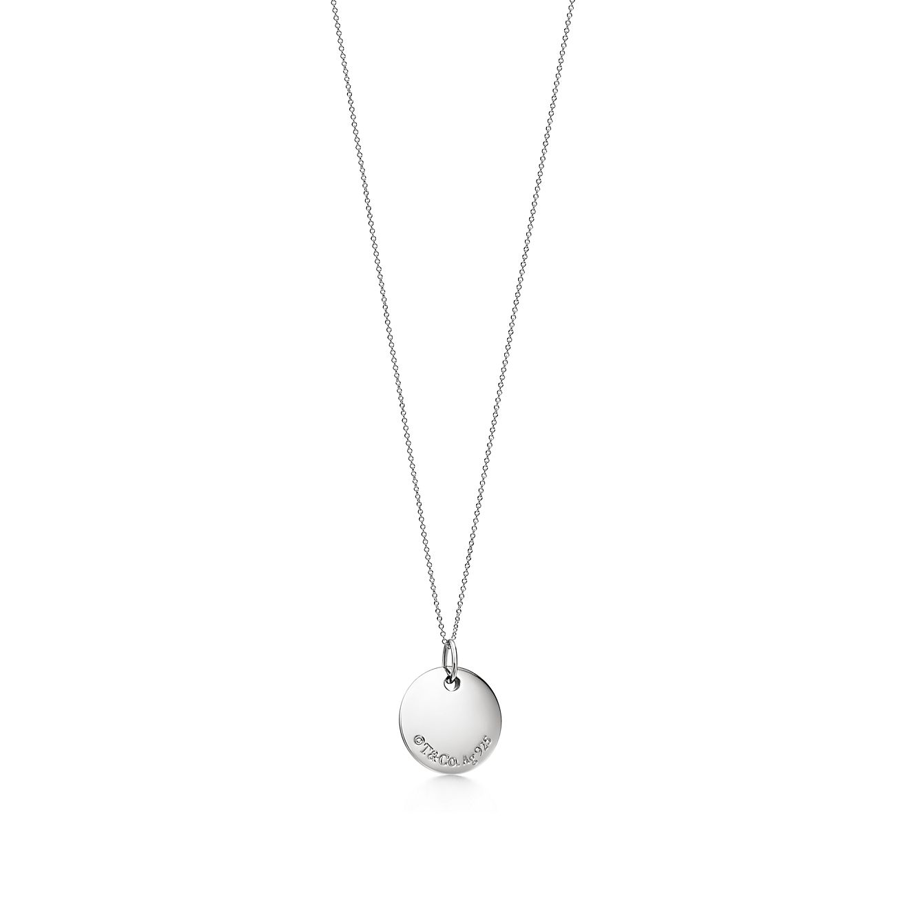 Tiffany Notes alphabet disc charm in silver on a chain. Letters