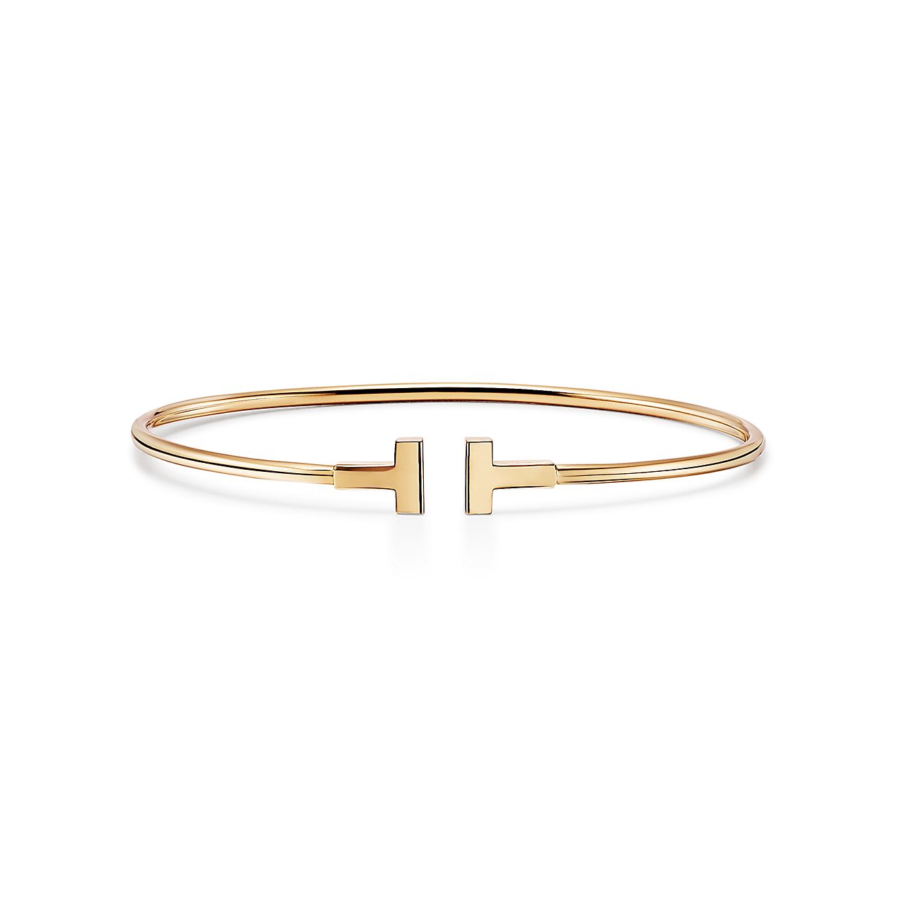 Tiffany T narrow wire bracelet in 18k gold, small. | Tiffany & Co.