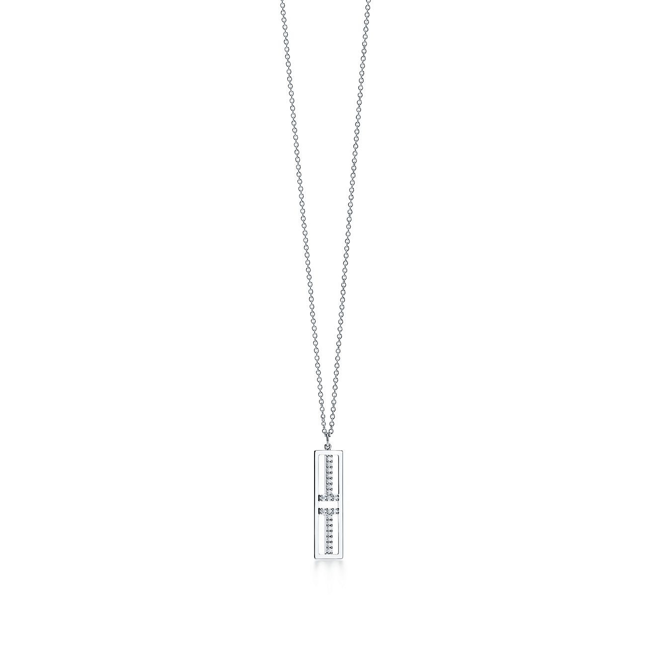 Tiffany T open vertical diamond bar pendant in 18k white gold. Tiffany & Co.