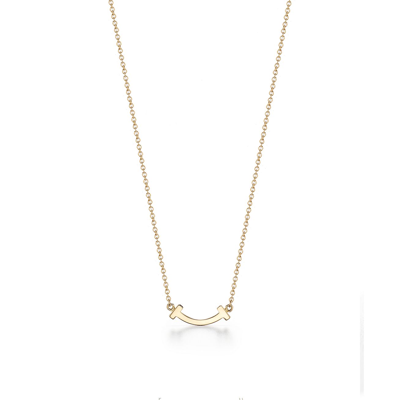 Tiffany T smile pendant in 18k gold with diamonds, mini. | Tiffany 