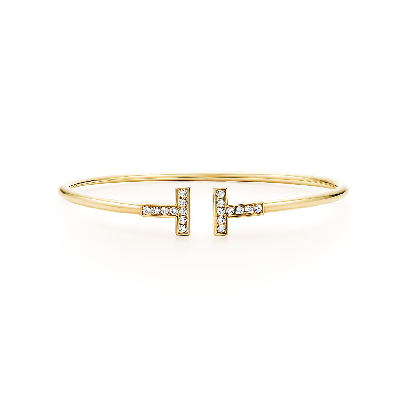 Tiffany T wire bracelet in 18k gold with diamonds, medium. | Tiffany & Co.