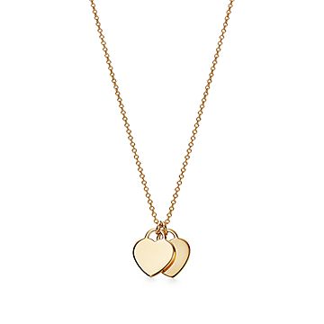 Return to Tiffany® mini double heart tag pendant in 18k gold.