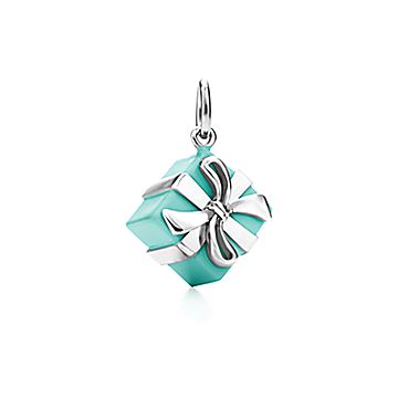 Sold at Auction: Tiffany & Co. - a shopping bag charm with Tiffany Blue  enamel finish, signed and marked 'AG 925 Germany', 2.1 cm drop, together  with travel pouch, exterior box and