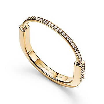 Cartie Love Gold Bangle Bracelet at 1stDibs  gold bracelet with circles,  gold ring with circle with line through it, rings with circle and line  through it