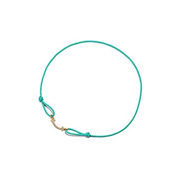 Tiffany T Smile Bracelet in Yellow Gold on a Blue Cord with