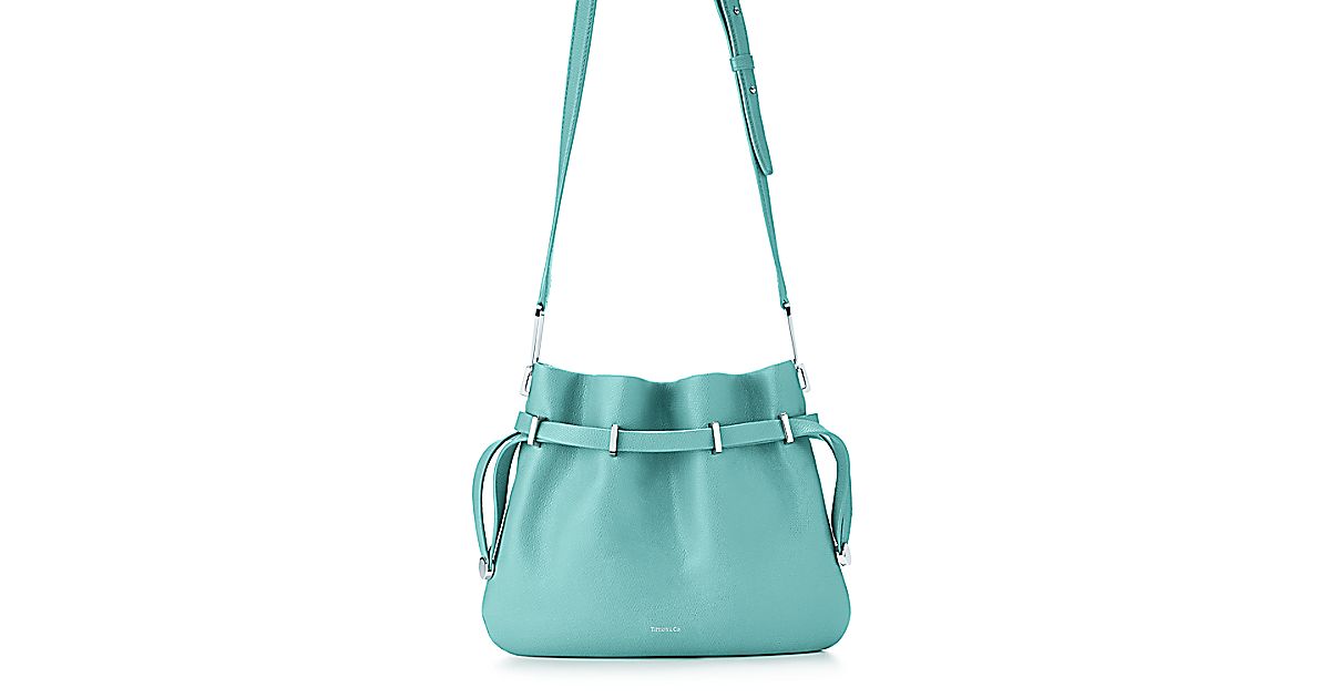 Blair crossbody bag in light teal textured leather. More colors ...