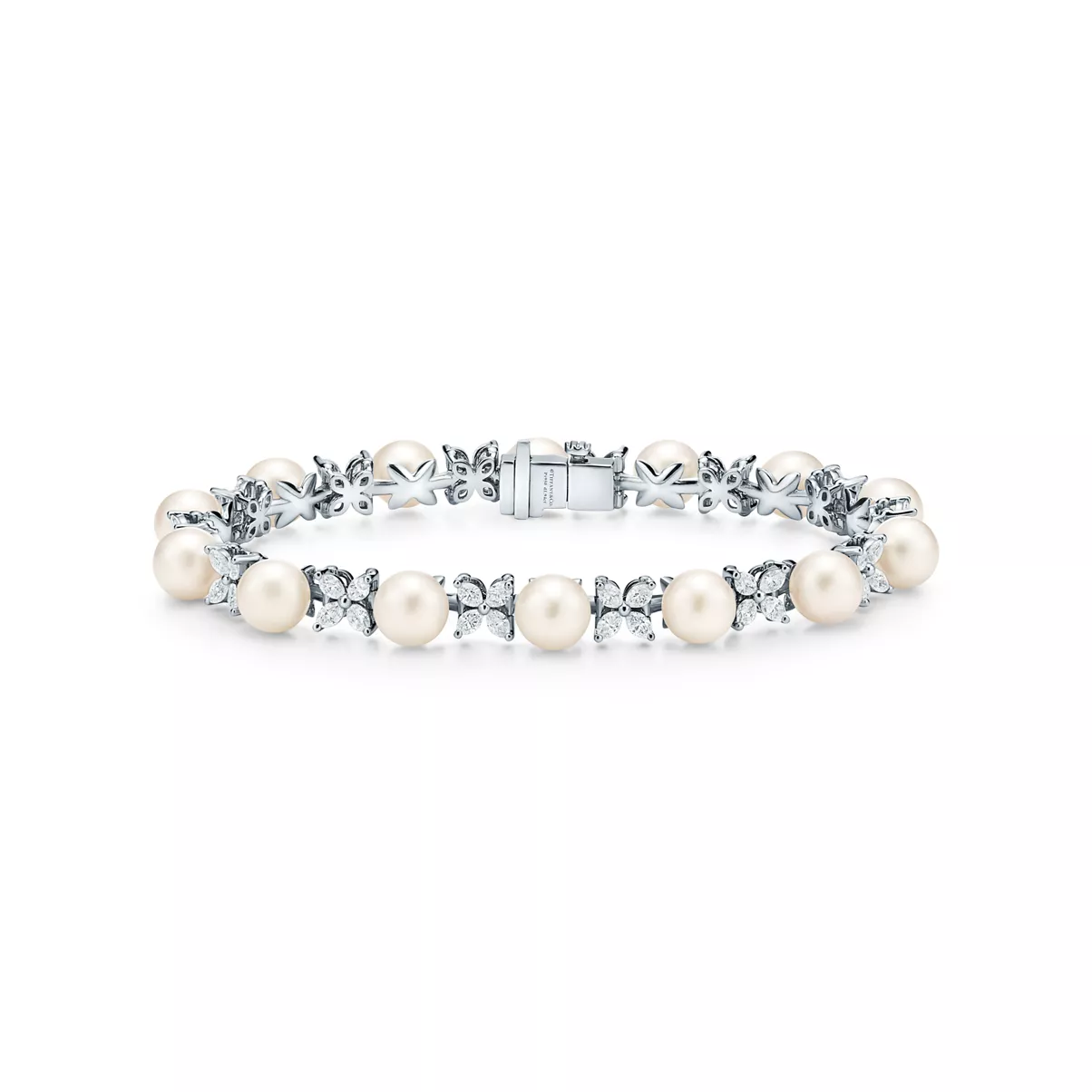 Tennisarmband in Platin mit Diamanten und Perlen