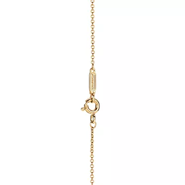 Tiffany T:Diamond Pendant in Gold with a Baguette Diamond, 3
