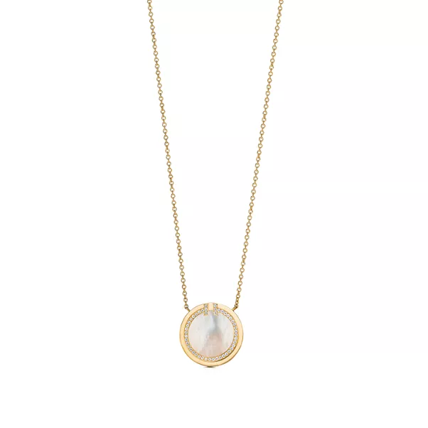 Colgante circular de diamantes y nácar de oro amarillo
